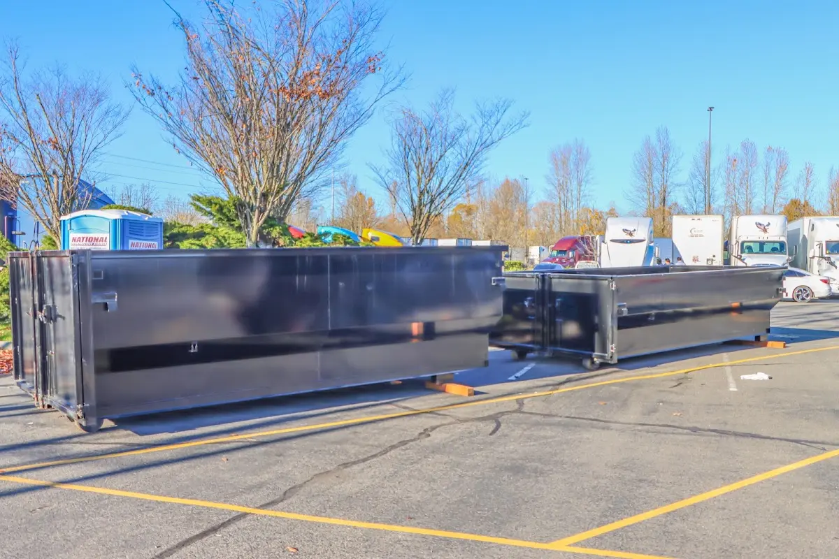 Professional dumpster rental service with roll-off container on residential driveway in Easley